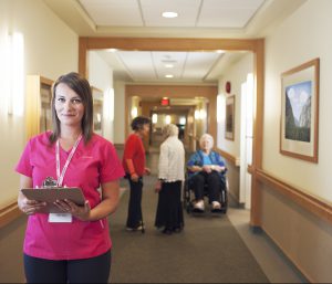 Care giver at hospital with Elderly lady after Nurse Next Door Transportation Services helps her from home to the Hospital