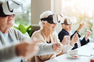 Shot of happy senior women using virtual reality headsets together at a retirement home